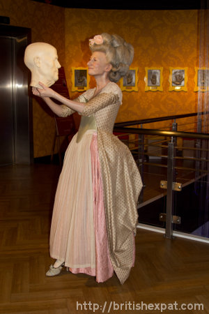 A waxwork of Marie Tussaud herself, with one of her creations