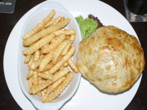 Steak and Guinness pie with chips